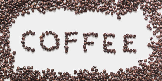 Specialty coffee beans spelling out "coffee" against a white background