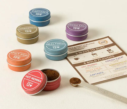 Assortment of six colorful small containers of Vashon Island Coffee Dust. Each small tin contains 12 servings for a total of 72 in the Expedition Kit. 