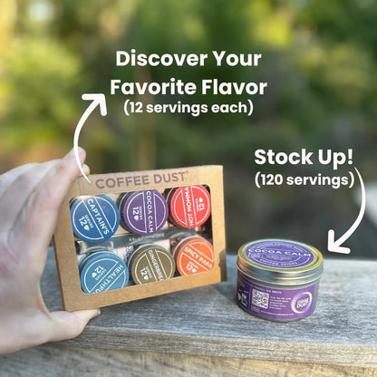 Vashon Island Coffee Dust Expedition Kit containing 6 flavors of coffee dust,  and a hand holding it. To its right is a full-size tin of Cocoa Calm coffee dust, providing an indication of the relative sizes of the small and large tins. Image set against a blurred natural background.