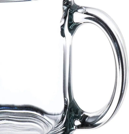 Crystal coffee mug close-up of handle against a white background.