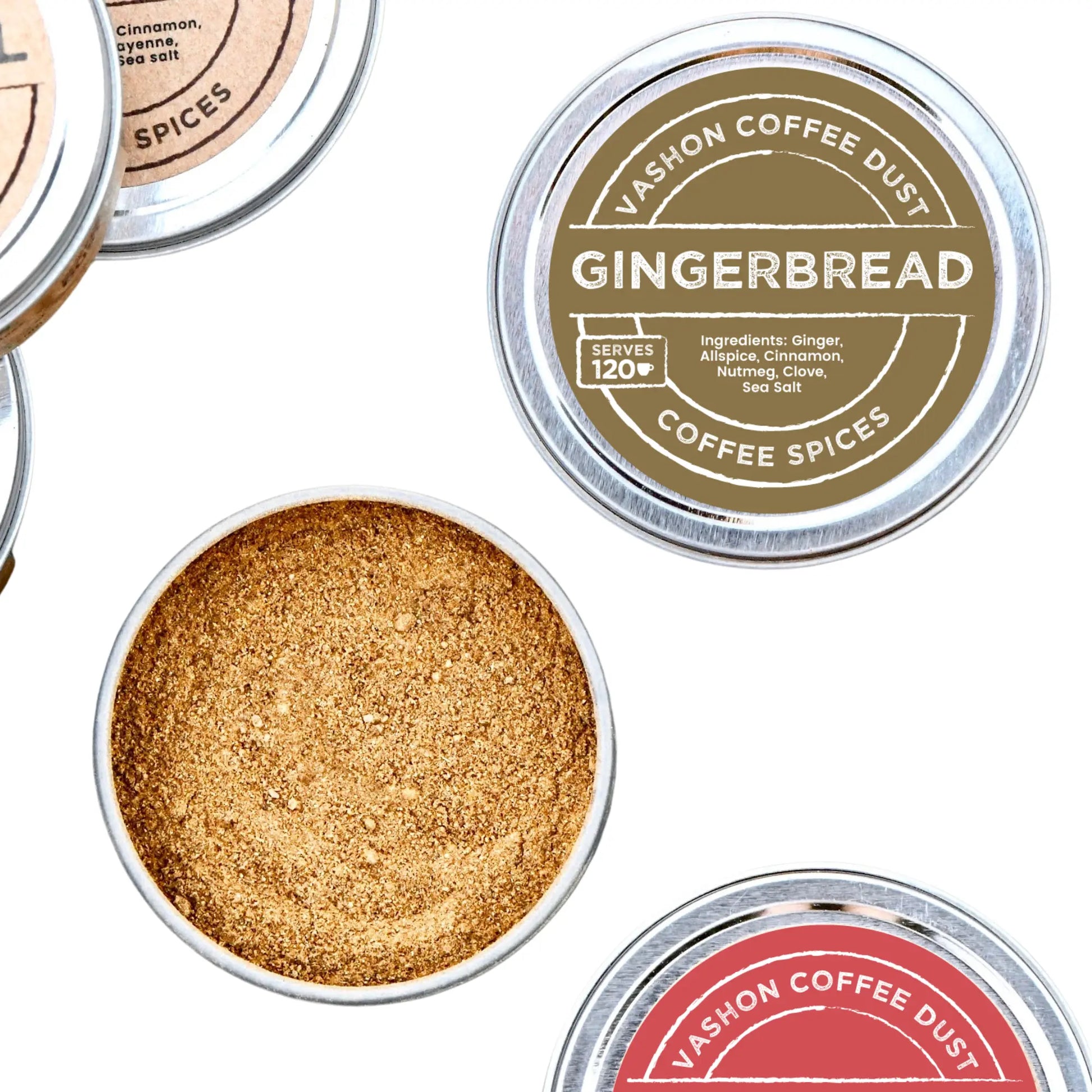 Full-size tin of Vashon Island Gingerbread coffee dust with the lid off to show the coffee dust inside. The lid indicates 120 servings. Parts of tins of other flavors are also depicted. 