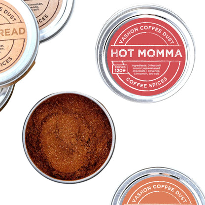 Tins of Vashon Island Coffee Dust highlighting the 'Hot Momma' flavor on a white background.