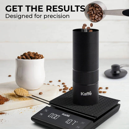 Manual coffee grinder by Kaffè is depicted atop a digital scale as coffee beans are being placed inside the grinder.